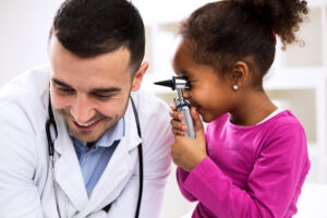Doctor otologist playing with his patient